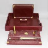 An Asprey red leather three piece desk set, tray 34.5cm long x 26cm wide, faux crocodile edges