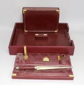 An Asprey red leather three piece desk set, tray 34.5cm long x 26cm wide, faux crocodile edges