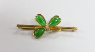 A Chinese yellow metal jade and diamond set petal bar brooch, 47mm, gross weight 4.9 grams, in