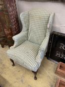 A Victorian style upholstered wing armchair, width 74cm, depth 80cm, height 114cm