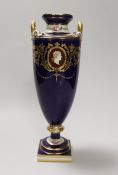 A Minton two handled vase painted with portrait medallions on a blue and gilt ground, 28cm high