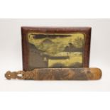 A Japanese lacquer games box, the cover having a central landscape painting together with a carved