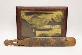A Japanese lacquer games box, the cover having a central landscape painting together with a carved
