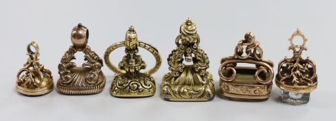 Six assorted 19th century yellow metal overlaid and carnelian or quartz set fob seals, largest 34mm,