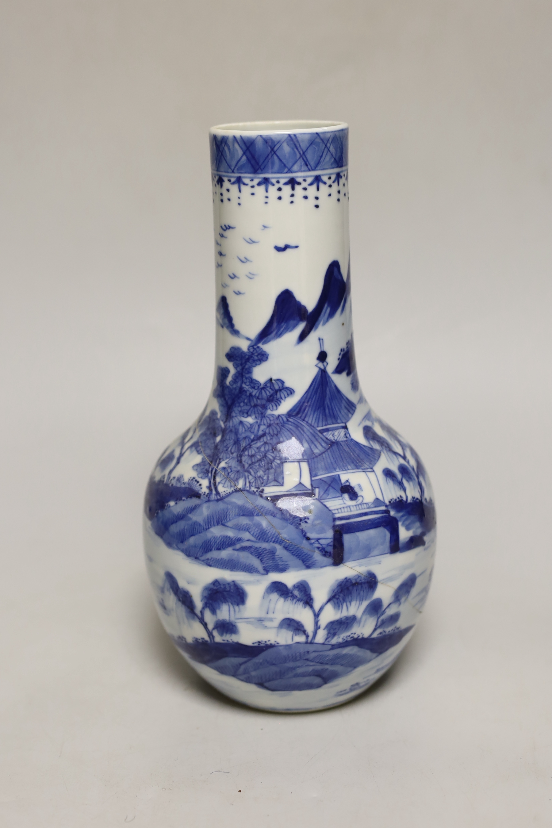 An early 20th century Chinese blue and white baluster vase, 25cm high (a.f.)