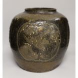 A large Chinese stoneware ovoid jar, decorated in relief with birds and flowers, possibly 19th