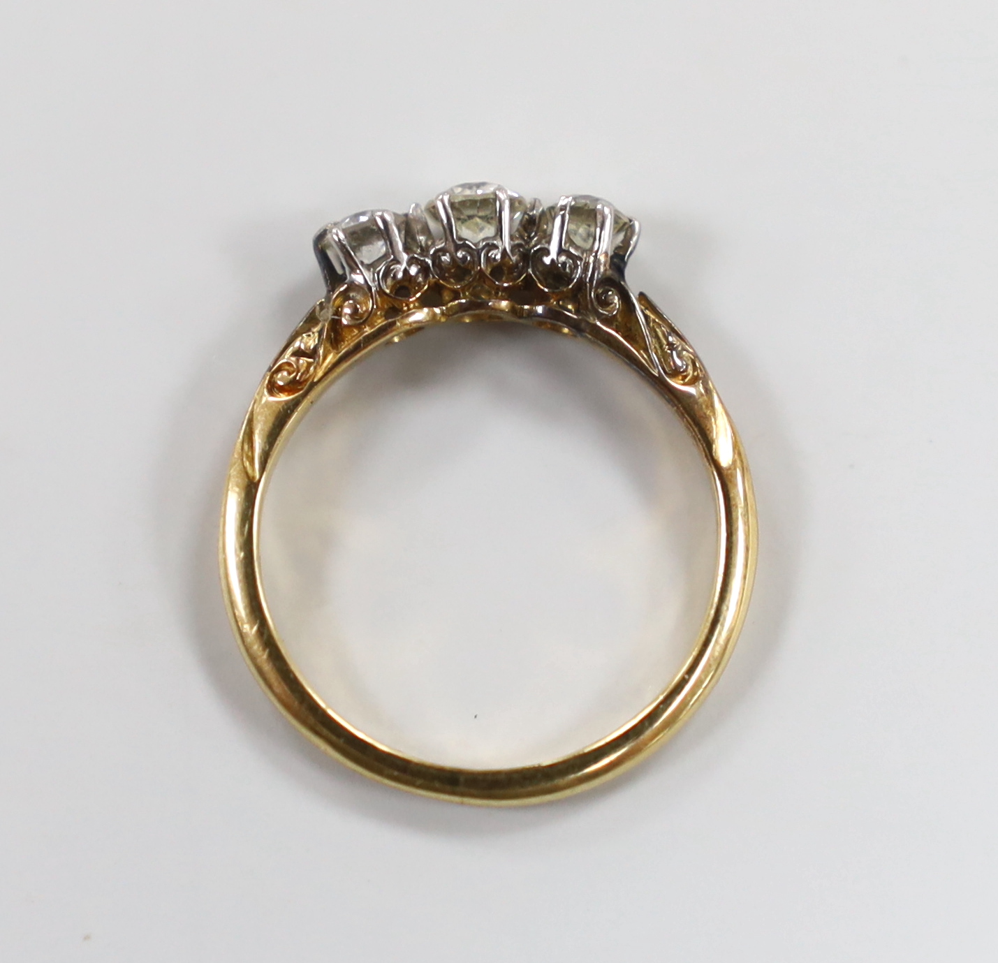 An 18ct and three stone diamond ring, size J, gross weight 2.2 grams. - Image 3 of 3