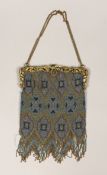 A late 19th century French gilt metal mounted coloured beaded evening bag, 17cm wide