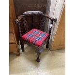 A Victorian carved oak corner elbow chair, width 67cm, depth 62cm, height 80cm
