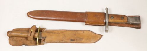 A Ross rifle Co. bayonet stamped ‘Quebec 1907’ and a Colonial dagger, both with scabbards