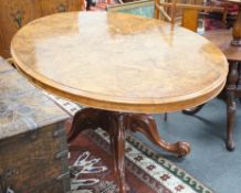 A Victorian figured walnut oval tilt top loo table, width 136cm, depth 102cm, height 74cm