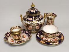 Seven pieces of Royal Crown Derby Imari porcelain including a trio and twin handled jar and cover,
