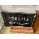 A vintage rectangular painted 'Russell & Bromley' advertising sign, length 123cm, height 78cm