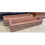 A pair of rectangular terracotta planters, moulded with bands of ivy leaves, width 90cm, depth 23cm,