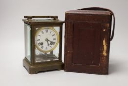 A large 19th century carriage clock with enamel dial and velvet lined leather case, the clock 19cm