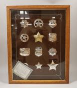 The Official Badges of Great Western Lawmen, cased set of sterling silver/silver gilt badges with