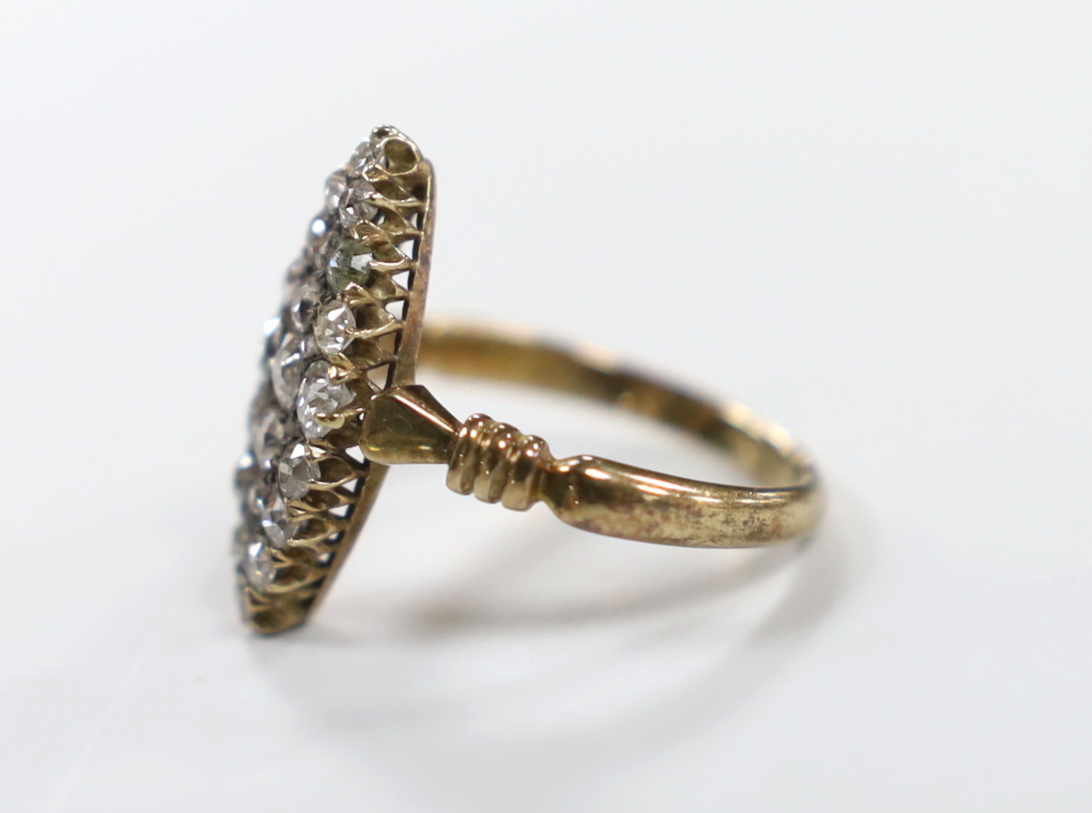 An early 20th century 18ct and diamond cluster set marquise shaped ring (one stone replaced), size - Image 2 of 3