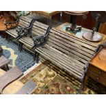 A cast metal slatted garden bench, length 130cm, depth 64cm, height 78cm, matching table and two