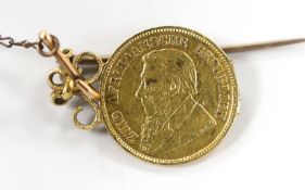 An 1892 gold half pond, in pendant mount, gross weight 5.9 grams.