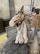 A carved driftwood horse head sculpture, height 98cm