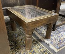 An Indian hardwood glass topped occasional table, width 60cm, depth 45cm, height 38cm