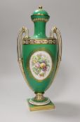 A Coalport two handled green ground vase and cover painted with a landscape, verso with fruit by