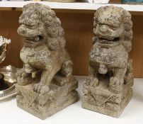 A pair of Chinese stone temple dogs, 47cm high