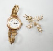 A lady's early 20th century 9ct gold, manual wind wrist watch, on a gold plated strap, together with
