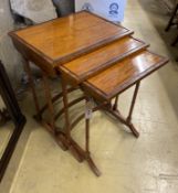 A nest of three rectangular rosewood banded satinwood tea tables, width 49cm, depth 38cm, height