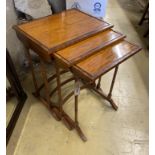 A nest of three rectangular rosewood banded satinwood tea tables, width 49cm, depth 38cm, height