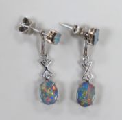 A modern pair of 585 white metal, two stone oval black opal doublet and two stone diamond chip set