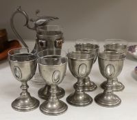 A set of six 20th century French pewter and glass goblets, together with larger example inset with
