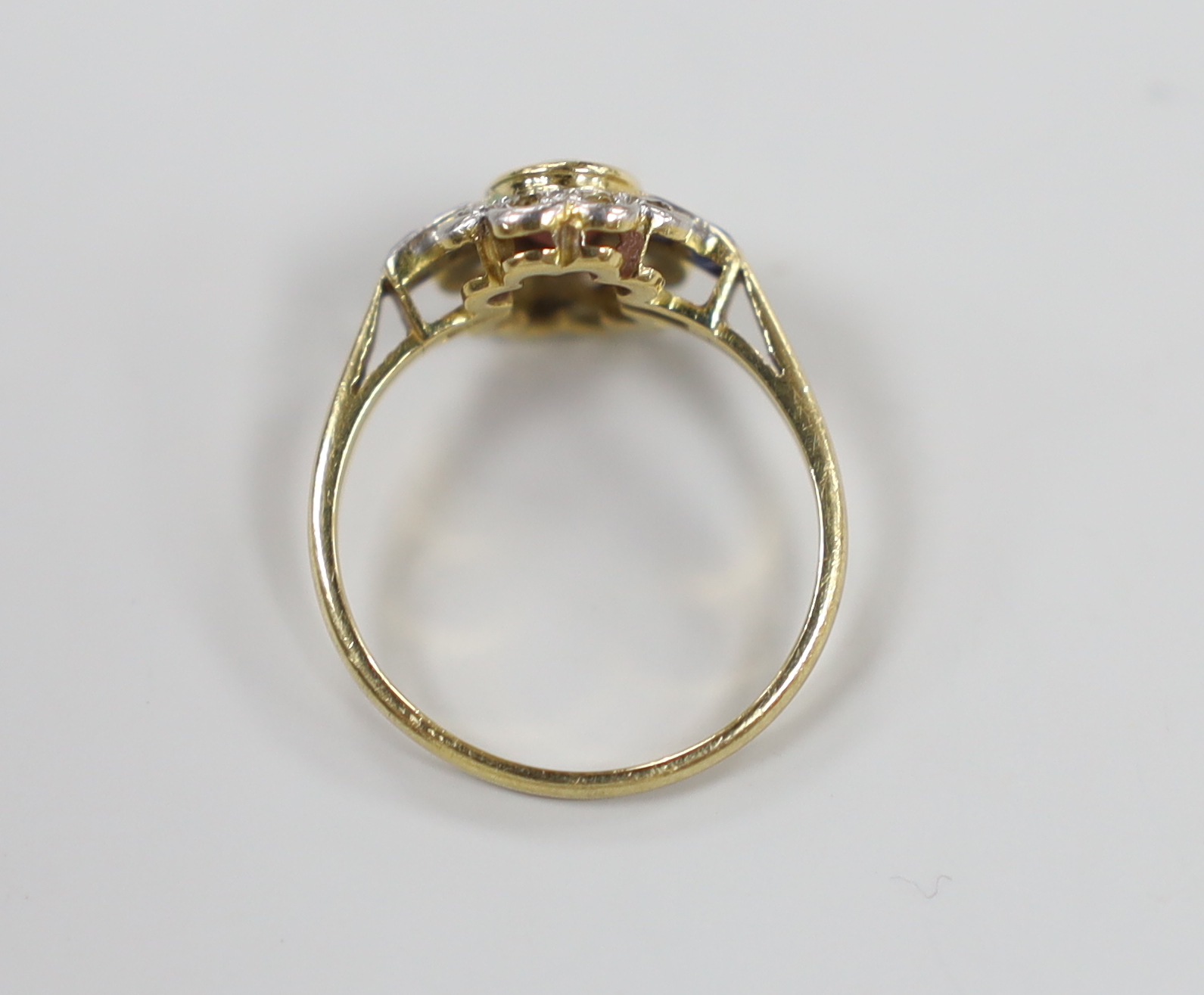 A 1920's/1930's yellow metal, ruby, sapphire and diamond set oval cluster ring, size O, gross weight - Image 3 of 3