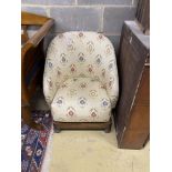 A 1920's tub framed upholstered child's chair, width 58cm, depth 60cm, height 70cm