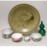 A Thai Sawankhalok celadon dish, 35cm, four rice and tea bowls and a double gourd vase
