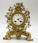 A 19th century gilt bronze and porcelain mounted mantel clock, the waisted case cast with