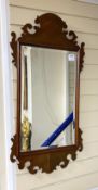 A George III style mahogany fret cut wall mirror, width 45cm, height 89cm