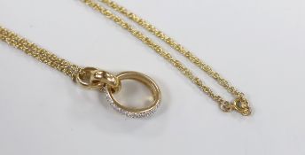 A modern 9ct gold and pave set diamond chip triple loop pendant, 31mm, on a 9ct chain, 52cm, gross