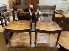 A pair of Regency provincial mahogany wood seat elbow chairs, width 54cm, depth 44cm, height 86cm