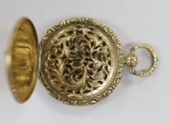 An engine turned yellow metal circular vinaigrette with pierced foliate grille, diameter 35mm.