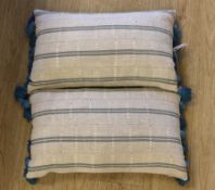 A pair of vintage Yoruba cushions with bamboo tassels, each 65cm wide