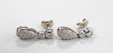 A modern pair of 18ct white gold and diamond chip pear shaped cluster drop earrings, 17mm, gross