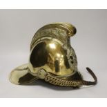 A late 19th/early 20th century brass Merryweather fire brigade helmet with embossed decoration and