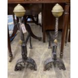 A pair of Victorian brass mounted cast iron andirons, height 62cm