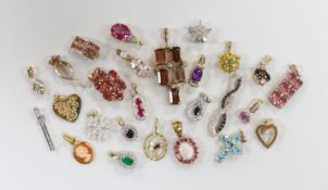 A collection of twenty one assorted modern 9ct gold and gem set pendants including diamond