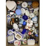 A large collection of porcelain and enamel trinket and patch boxes, together with miniature
