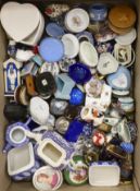 A large collection of porcelain and enamel trinket and patch boxes, together with miniature