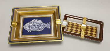 A Hermes-Paris porcelain cigar ashtray decorated with a stylised fish and a similar gilt metal