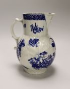 An 18th century Worcester fine mask jug decorated with the Parrot Pecking Fruit pattern, disguised