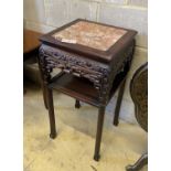 A Chinese carved hardwood rouge marble topped two tier vase stand, width 41cm, height 81cm